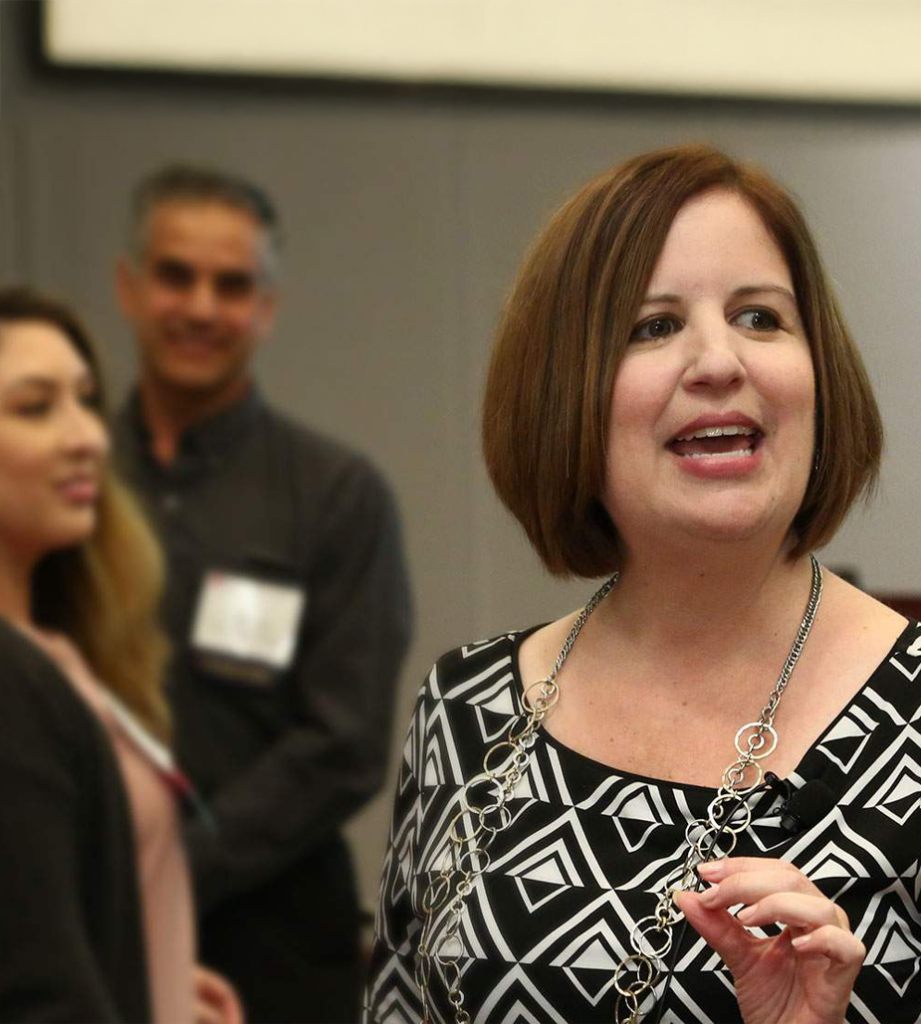 patricia bravo speaking to an audience